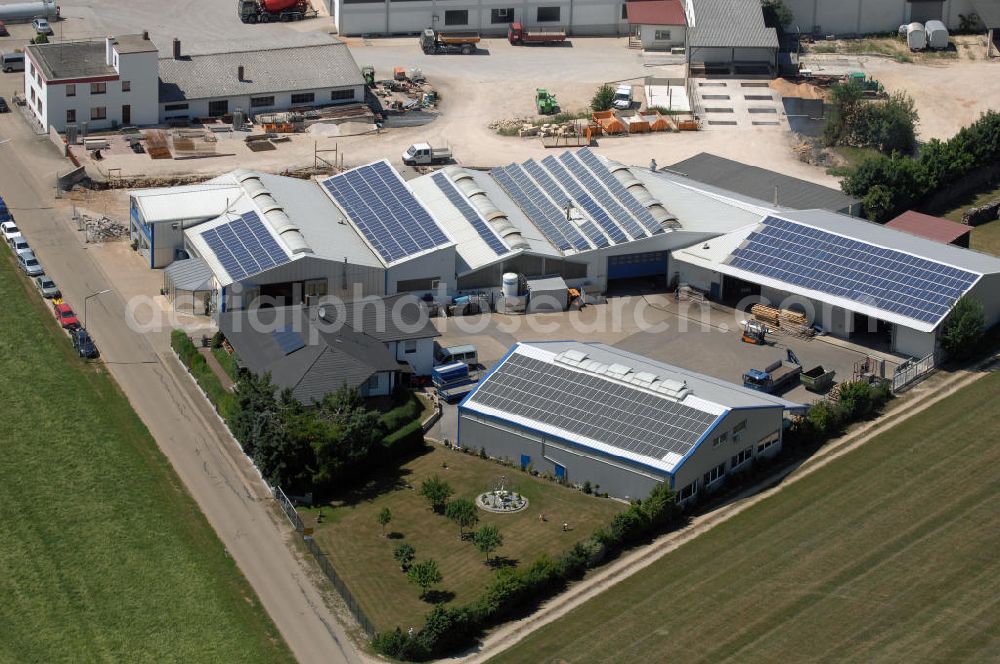 Aerial photograph Pappenheim - Blick auf ein Firmengelände in Pappenheim OT Geislohe. Die Firma FHG-Bau Geislohe ist seit 1925 in Familienbesitz. Mit 40 Mitarbeitern führt sie Hoch- und Tiefbauarbeiten aus. Kontakt: F.Hüttinger GmbH & Co. Bau KG, Geislohe 38, 91788 Pappenheim, Tel. +49 (0)9149 94 11 0, Fax +49 (0)9149 94 11 50, Email info@fhg-bau.de