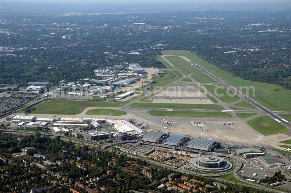 Aerial photograph Hamburg - Blick auf den Flughafen Hamburg. Der Flughafen ist der internationale Flughafen der Hansestadt Hamburg. Er ist der älteste und fünftgrößte Flughafen Deutschlands. Mittlerweile gehört er zu Europas modernsten Flughäfen. Kontakt: Flughafen Hamburg GmbH, Flughafenstr. 1 - 3, 22335 Hamburg, Tel.: +49(0)405075 0, Fax: +49(0)405075 1234, E-Mail: fhg@ham.airport.de