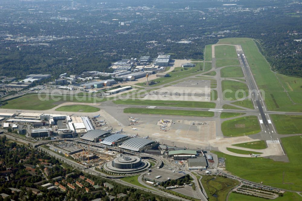 Hamburg from above - Blick auf den Flughafen Hamburg. Der Flughafen ist der internationale Flughafen der Hansestadt Hamburg. Er ist der älteste und fünftgrößte Flughafen Deutschlands. Mittlerweile gehört er zu Europas modernsten Flughäfen. Kontakt: Flughafen Hamburg GmbH, Flughafenstr. 1 - 3, 22335 Hamburg, Tel.: +49(0)405075 0, Fax: +49(0)405075 1234, E-Mail: fhg@ham.airport.de