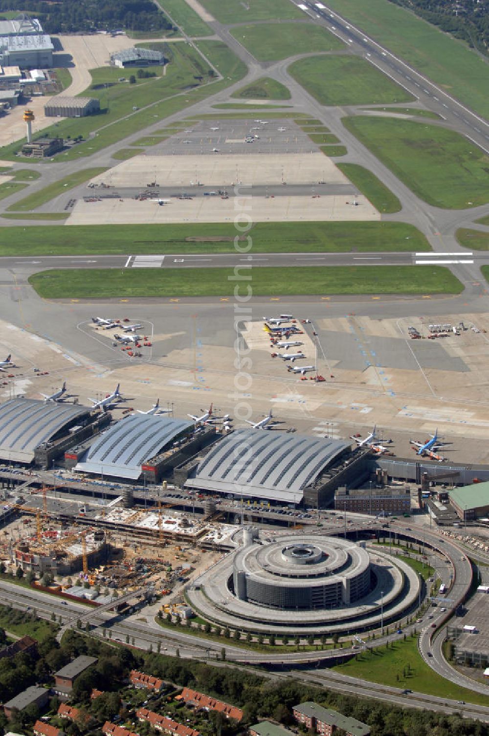 Aerial image Hamburg - Blick auf den Flughafen Hamburg. Der Flughafen ist der internationale Flughafen der Hansestadt Hamburg. Er ist der älteste und fünftgrößte Flughafen Deutschlands. Mittlerweile gehört er zu Europas modernsten Flughäfen. Kontakt: Flughafen Hamburg GmbH, Flughafenstr. 1 - 3, 22335 Hamburg, Tel.: +49(0)405075 0, Fax: +49(0)405075 1234, E-Mail: fhg@ham.airport.de