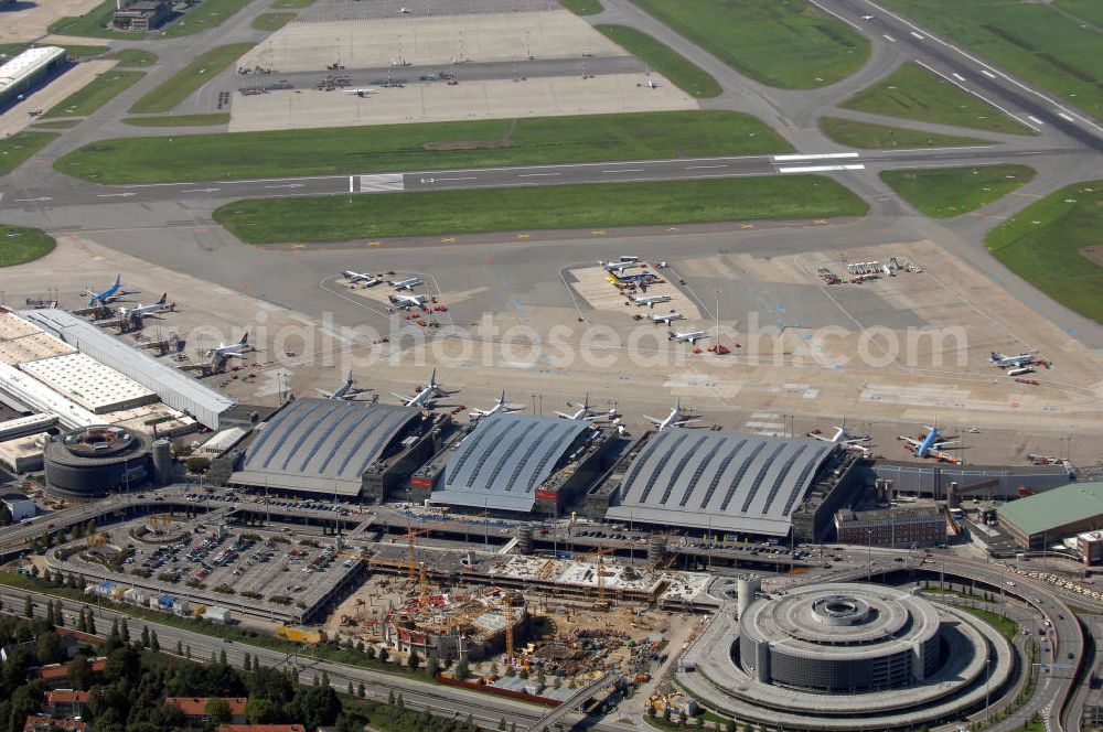 Aerial photograph Hamburg - Blick auf den Flughafen Hamburg. Der Flughafen ist der internationale Flughafen der Hansestadt Hamburg. Er ist der älteste und fünftgrößte Flughafen Deutschlands. Mittlerweile gehört er zu Europas modernsten Flughäfen. Kontakt: Flughafen Hamburg GmbH, Flughafenstr. 1 - 3, 22335 Hamburg, Tel.: +49(0)405075 0, Fax: +49(0)405075 1234, E-Mail: fhg@ham.airport.de