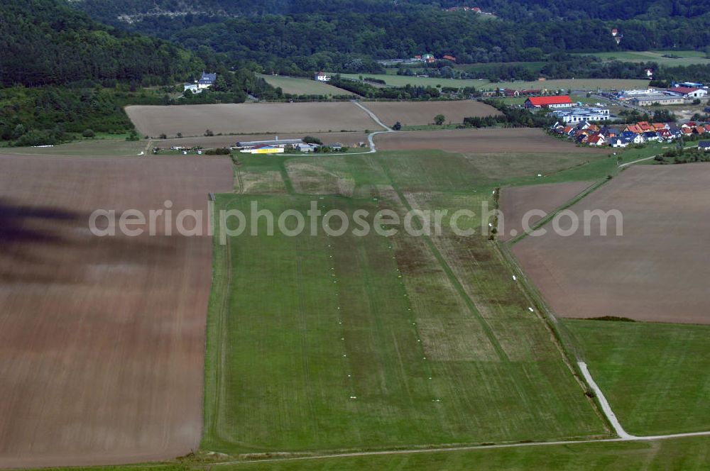 Aerial photograph Bad Berka - Blick auf den Flugplatz Bad Berka. Im Jahr 1962 wurde er eröffnet und von Luftsportlern aus Bad Berka, Weimar und der Umgebung genutzt. Auf Grund zu hoher Kosten wurde der Platz 1979 geschlossen, jedoch nach der Wiedervereinigung 1990 erneut geöffnet. Seitdem ist er bei Segelfliegern aus ganz Deutschland und dem Ausland sehr beliebt. Zum Platz gehören auch eine Flughalle, die 1999 neu gebaut wurde mit dazugehörigem Clubraum und einem Campingplatz. Genutzt wird der Flugplatz vor allem von dem Fliegerclub Bad Berka - Weimar e.V. Kontakt: Fliegerclub Bad Berka - Weimar e.V., Am Hexenberg 99438 Bad Berka, Tel. +49(0)36458 41173, Fax +49(0)361 3451904, Email: info@fcbb.de