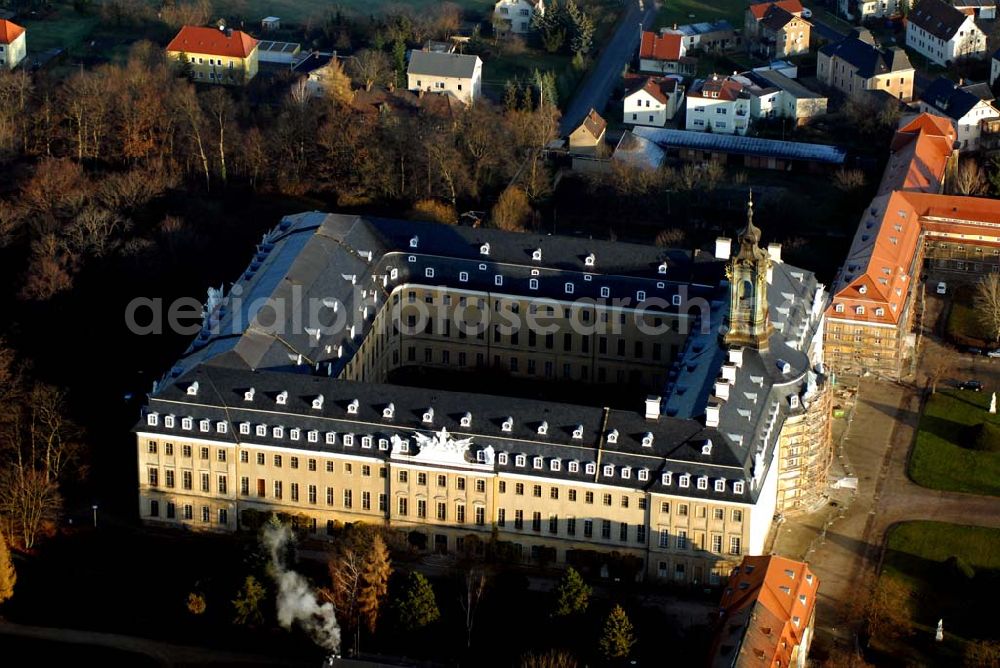 Wermsdorf from the bird's eye view: Blick auf fortgeschrittene Rekonstruktionsarbeiten an der Hubertusburg in Wermsdorf in Sachsen, dessen Bau im 18. Jahrhundert durch August den Starken veranlasst wurde.Der Neubau Johann Christoph von Naumanns aus dem Jahre 1721 - 1724 ersetzte das alte Jagdschloss Hubertusburg, benannt nach Sankt Hubertus, dem Schutzpatron der Jagd. Es ist das größte Schloss in Sachsen, mit viel Prunk in den Sälen, für rauschende Feste erbaut, die nach den Hofjagden stattfanden. Im Siebenjährigen Krieg (1756 - 1763) wurde das Schloss durch die Preußen geplündert, deshalb fehlen heute alle Einrichtungen aus der höfischen Zeit. Nur die katholische Schlosskapelle überstand die Plünderung.Durch den Frieden von Hubertusburg, der 1763 den Siebenjährigen Krieg beendete, ging das Schloss in die europäische Geschichte ein. http://