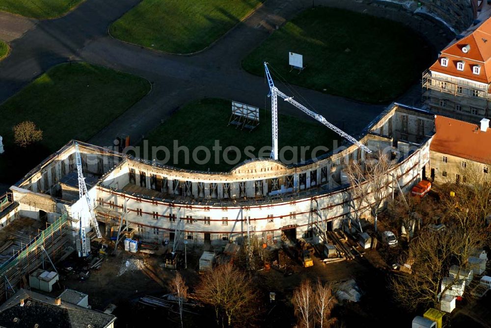 Aerial photograph Wermsdorf - Blick auf fortgeschrittene Rekonstruktionsarbeiten an der Hubertusburg in Wermsdorf in Sachsen, dessen Bau im 18. Jahrhundert durch August den Starken veranlasst wurde.Der Neubau Johann Christoph von Naumanns aus dem Jahre 1721 - 1724 ersetzte das alte Jagdschloss Hubertusburg, benannt nach Sankt Hubertus, dem Schutzpatron der Jagd. Es ist das größte Schloss in Sachsen, mit viel Prunk in den Sälen, für rauschende Feste erbaut, die nach den Hofjagden stattfanden. Im Siebenjährigen Krieg (1756 - 1763) wurde das Schloss durch die Preußen geplündert, deshalb fehlen heute alle Einrichtungen aus der höfischen Zeit. Nur die katholische Schlosskapelle überstand die Plünderung.Durch den Frieden von Hubertusburg, der 1763 den Siebenjährigen Krieg beendete, ging das Schloss in die europäische Geschichte ein. http://