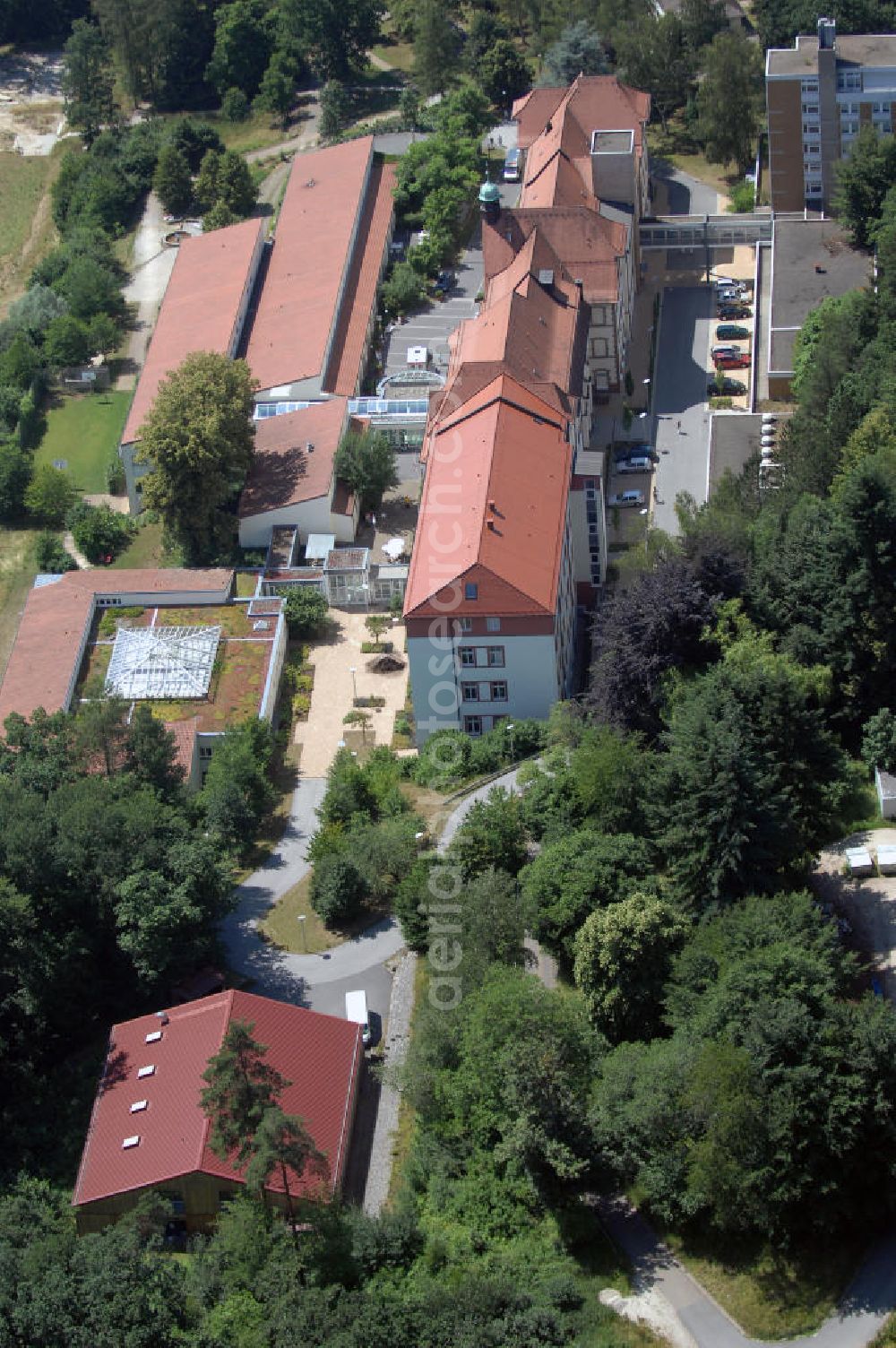 Aerial photograph Engelthal - Blick auf die Frankenalb-Klinik Engelthal. Sie ist eine Fachklinik für Psychiatrie, Suchtrehabilitation und Psychotherapie. Sie unterliegt der Trägerschaft des Bezirks Mittelfranken. Die Klinik wurde 1898 auf dem Reschenberg erbaut und 1900 als Lungenheilstätte mit 100 Betten in Betrieb genommen. Zwischenzeitlich war sie ein Kinderheim im Zweiten Weltkrieg. Seit 1973 ist sie eine Klinik, die sich auf die Behandlung von psychischen und psychosomatischen Erkrankungen spezialisiert hat. Kontakt: Frankenalb-Klinik Engelthal Reschenbergstraße 20, 91238 Engelthal, Tel. +49 (0)9158 926 0, Fax +49 (0)9158 926 199, Email frankenalbklinik@bezirkskliniken-mfr.de