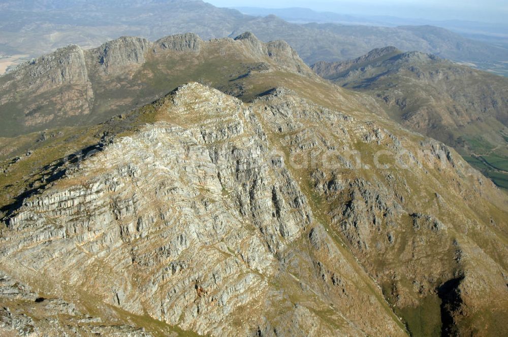 FRANSCHHOEK from above - View of the surroundings of Wemmershoek Mountain near Franschhoek, South Africa. In the foothills of the mountains are the Cape winelands