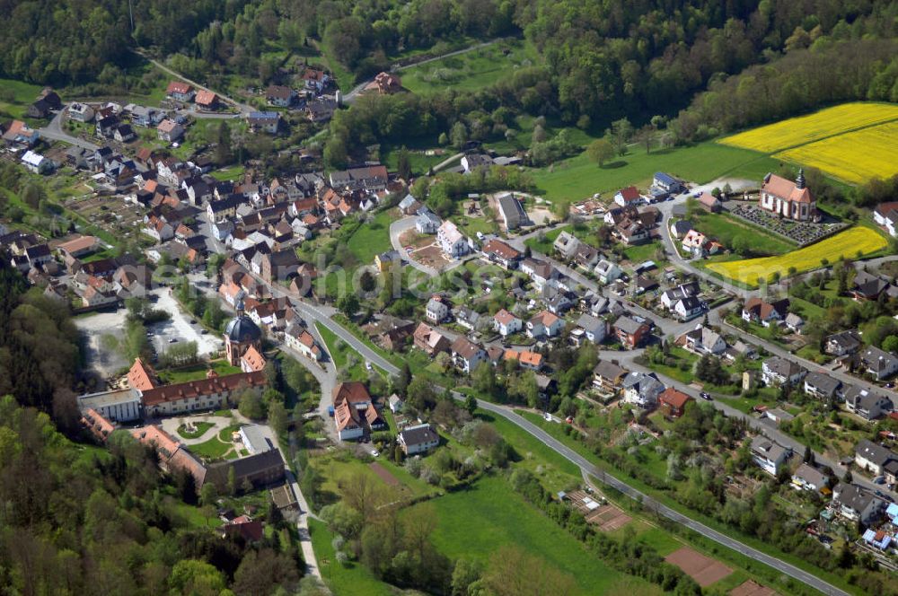 Aerial photograph Holzkirchen - Blick auf die Gemeinde Holzkirchen in Unterfranken. Das vor 775 gegründete Kloster Holzkirchen und der Ort waren Teil des Gebietes des Hochstiftes Würzburg und fielen im Reichsdeputationshauptschluss an die Grafen Löwenstein-Wertheim. Im Zuge der Verwaltungsreformen in Bayern entstand mit dem Gemeindeedikt von 1818 die heutige Gemeinde. Verwaltungsgemeinschaft: Im Kies 8 , 97264 Helmstadt, Tel. +49 (0)9369 9079 0, +49 (0)9369 9079 90