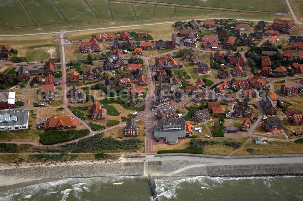 Aerial image Baltrum - Blick auf die Gemeinde und die Insel Baltrum. Sie ist mit 6,6 qkm die kleinste der sieben dauerhaft bewohnten ostfriesischen Hauptinseln. Baltrum verfügt über einen Fährhafen, einen kleinen Flugplatz und verschiedene Fremdenverkehrseinrichtungen. Gemeinde- und Kurverwaltung Nordseeheilbad Insel Baltrum, Postfach 1355, 26574 Baltrum, Tel. +49 (0)4939 80 0, Fax +49 (0)4939 80 27, gemeinde@baltrum.de