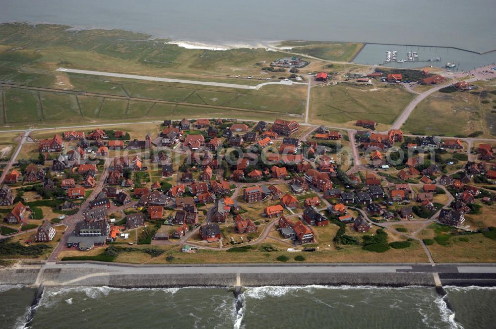 Aerial photograph Baltrum - Blick auf die Gemeinde und die Insel Baltrum. Sie ist mit 6,6 qkm die kleinste der sieben dauerhaft bewohnten ostfriesischen Hauptinseln. Baltrum verfügt über einen Fährhafen, einen kleinen Flugplatz und verschiedene Fremdenverkehrseinrichtungen. Gemeinde- und Kurverwaltung Nordseeheilbad Insel Baltrum, Postfach 1355, 26574 Baltrum, Tel. +49 (0)4939 80 0, Fax +49 (0)4939 80 27, gemeinde@baltrum.de