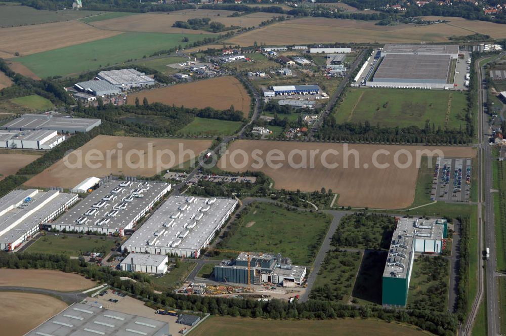 Ohrdruf from the bird's eye view: Blick auf das Gewerbe- und Industriegebiet nordwestlich von der Stadt Ohrdruf. Es wurde 1991 erschlossen, seitdem haben sich diverse Unternehmen dort angesiedelt. Eines der bekanntesten und größten ist die August Storck KG. Kontakt: August Storck KG, Am Gehrengraben 2 99885 Ohrdruf, Tel. +49(0)3624 334 0, Fax +49(0)3624 334 2255, Email: info@de.storck.com