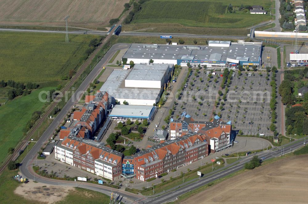 Aerial photograph Schwerin - Blick auf das Gewerbegebiet im Norden Schwerins. Hier befinden sich verschiedene Einkaufsmöglichkeiten im Margaretenhof und Plaza Center. Sie reichen von Textil-, über Lebensmittelgeschäfte, Möbelhäuser und einen Baumarkt. Kontakt: Plaza Center: coop eG, Benzstraße 10 24148 Kiel, Tel. +49(0)431 7250 0, Email: inof@coop.de; Center Management Margaretenhof GmbH, Am Margaretenhof 28 19057 Schwerin, Tel. +49(0)385 4867913