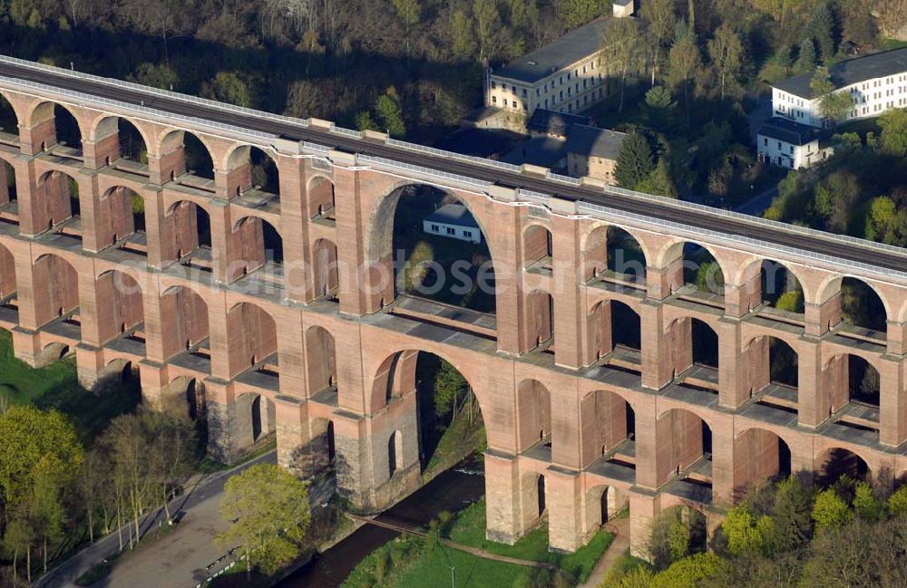 Aerial photograph Reichenbach (Sachsen) - Blick auf die Göltzschtalbrücke bei Reichenbach im ogtland. Der Viadukt wurde in den Jahren 1846 bis 1851 durch Prof. Johann Schubert und die Ingenieure Robert Wilke und Ferdinand Dost im Auftrag der Sächsisch-Bayrischen Eisenbahn erbaut. Er gilt bis heute als die größte Ziegelbrücke der Welt. Auch heute wird er rege genutzt und immer wieder neuen Gegebenheiten angepasst und technisch verbessert.