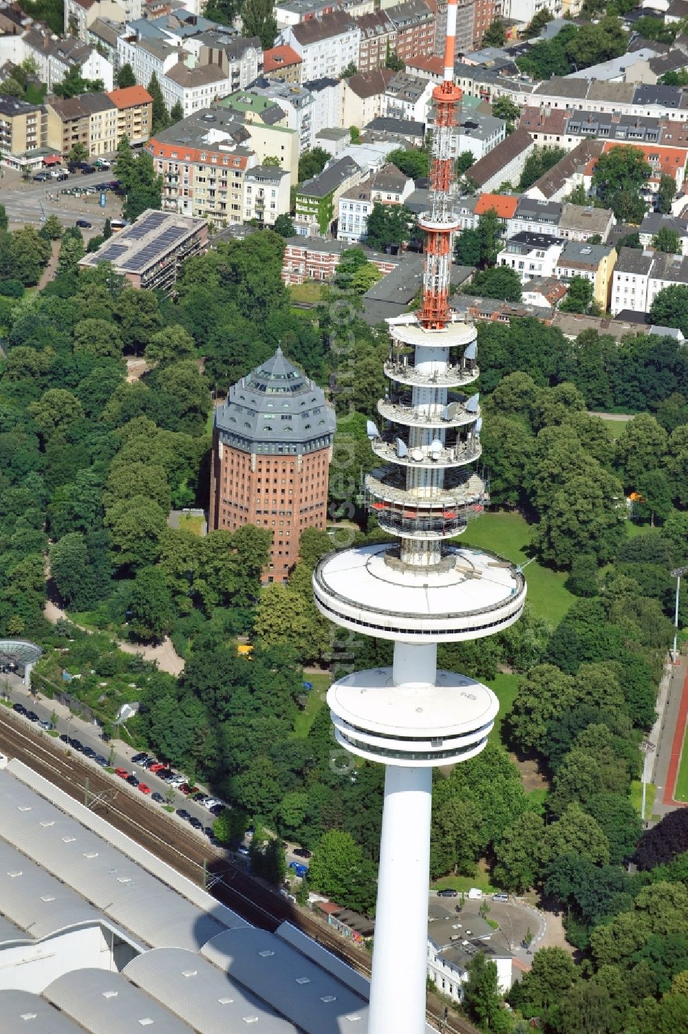 Hamburg from above - View of the Heinrich-Hertz-Turm in Hamburg. The 279m high tower, which is used for telecommunication and as broadcast station, was built from 1966 to 1968 and belongs to the Deutsche Funkturm GmbH. It is to remember the physicist Heinrich Hertz, who was born in Hamburg, and offers a rotating viewing and restaurant platform