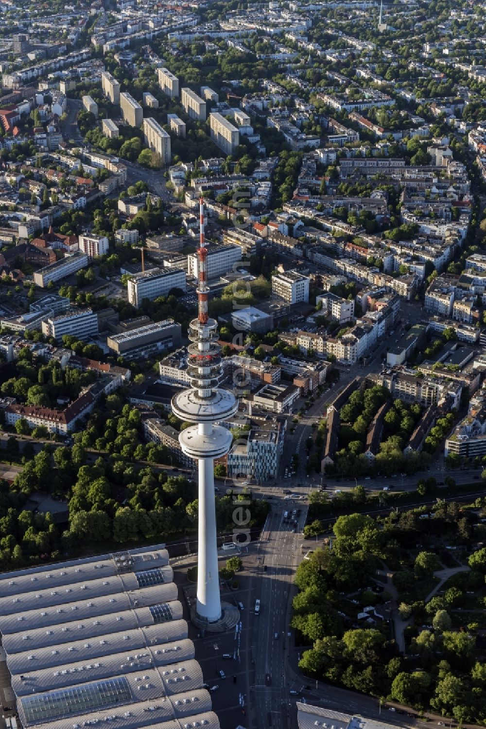 Hamburg from above - View of the Heinrich-Hertz-Turm in Hamburg. The 279m high tower, which is used for telecommunication and as broadcast station, was built from 1966 to 1968 and belongs to the Deutsche Funkturm GmbH. It is to remember the physicist Heinrich Hertz, who was born in Hamburg, and offers a rotating viewing and restaurant platform