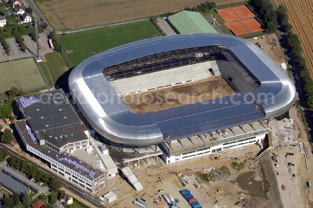 Aerial image Klagenfurt - Die Hypo-Arena ist das derzeit in Bau befindliche Fußballstadion der Stadt Klagenfurt (Kärnten). Das heftig umstrittene Stadion wird für die in Klagenfurt stattfindenden Vorausscheidungsspiele der Fußball-Europameisterschaft 2008 errichtet und soll in späterer Folge als Heimstadion für den SK Austria Kärnten dienen. Es befindet sich im Stadtteil Waidmannsdorf an der Umfahrungsstraße Südring.