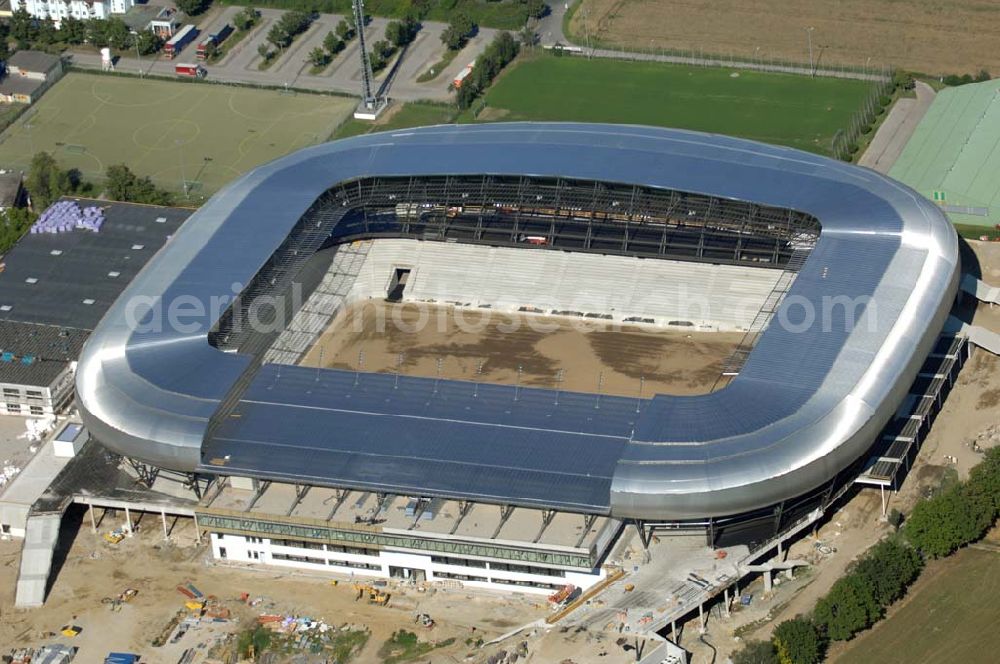 Aerial photograph Klagenfurt - Die Hypo-Arena ist das derzeit in Bau befindliche Fußballstadion der Stadt Klagenfurt (Kärnten). Das heftig umstrittene Stadion wird für die in Klagenfurt stattfindenden Vorausscheidungsspiele der Fußball-Europameisterschaft 2008 errichtet und soll in späterer Folge als Heimstadion für den SK Austria Kärnten dienen. Es befindet sich im Stadtteil Waidmannsdorf an der Umfahrungsstraße Südring.