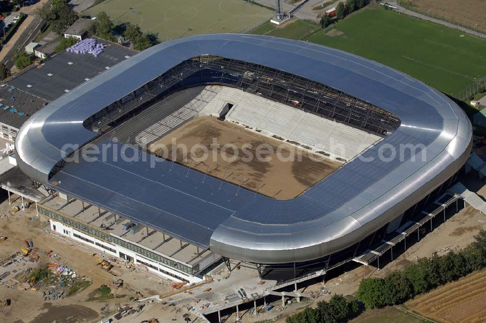 Aerial image Klagenfurt - Die Hypo-Arena ist das derzeit in Bau befindliche Fußballstadion der Stadt Klagenfurt (Kärnten). Das heftig umstrittene Stadion wird für die in Klagenfurt stattfindenden Vorausscheidungsspiele der Fußball-Europameisterschaft 2008 errichtet und soll in späterer Folge als Heimstadion für den SK Austria Kärnten dienen. Es befindet sich im Stadtteil Waidmannsdorf an der Umfahrungsstraße Südring.