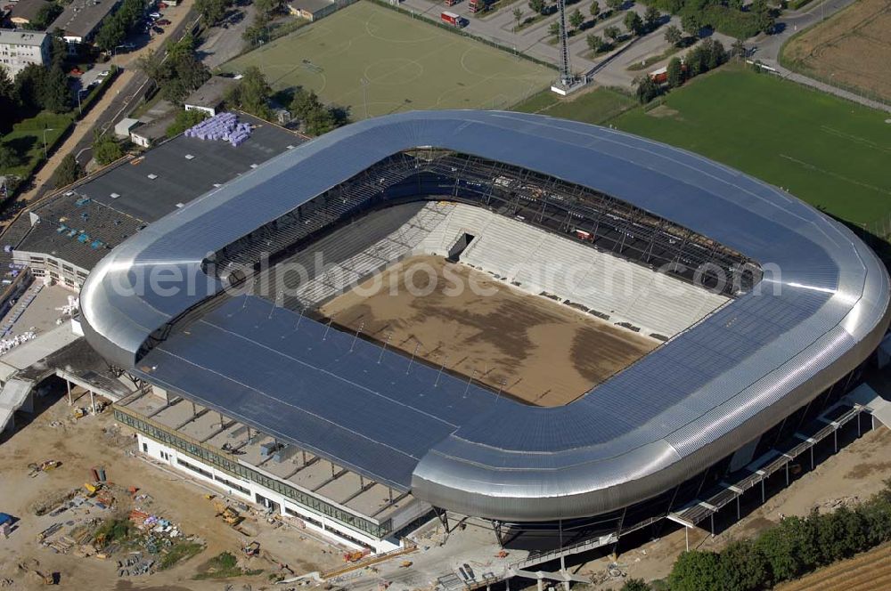 Aerial photograph Klagenfurt - Die Hypo-Arena ist das derzeit in Bau befindliche Fußballstadion der Stadt Klagenfurt (Kärnten). Das heftig umstrittene Stadion wird für die in Klagenfurt stattfindenden Vorausscheidungsspiele der Fußball-Europameisterschaft 2008 errichtet und soll in späterer Folge als Heimstadion für den SK Austria Kärnten dienen. Es befindet sich im Stadtteil Waidmannsdorf an der Umfahrungsstraße Südring.