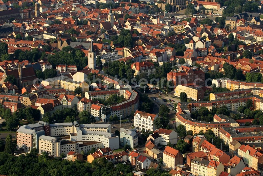 Aerial image Erfurt - From Juri-Gagarin-Ring we look towards the southwest in the old town of Erfurt in Thuringia. There are a lot of former monasteries and historic churches. Directly on the residential area - On the hill - is the Nikolaiturm the residue of a former parish church. To the left, in the Augustinian road, stands the Augustinian monastery where Martin Luther lived as a monk and worked. Further afield, the St. Michael's Church, the Church of All Saints and the Georg church tower can be seen. In the center of the image is the Arts and Crafts School Erfurt