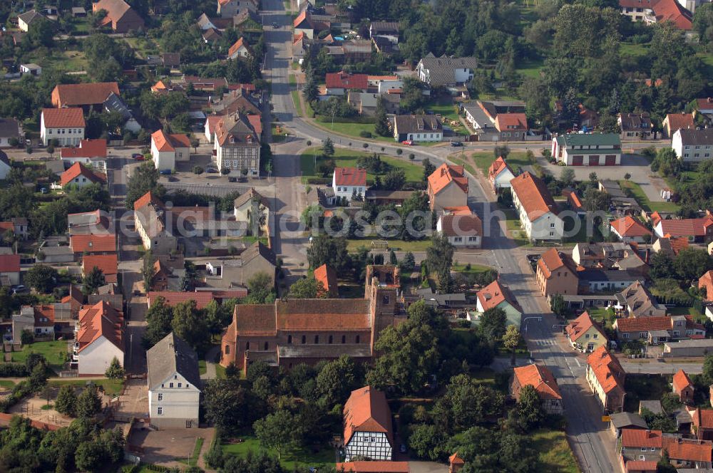 Aerial image Sandau - Blick auf die Kirche Kirche St.Laurentius / St.Nicolaus in Sandau. Sie steht an der Straße der Romanik. Die Straße der Romanik verbindet die Dome, Burgen, Klöster und Kirchen die in der Zeit vom 10. bis Mitte des 13. Jahrhundert entstanden, und somit ein Zeichen der Christianisierung sind.