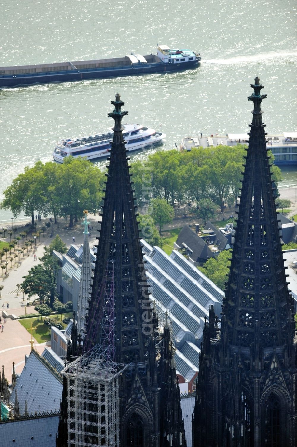 Aerial image Köln - View of the Cologne Cathedral with scaffolding on the north tower.The the 157-meter high Gothic building, whose construction started in 1248 and was completed in 1880, belongs to the UNESCO World Heritage since 1996 and is redeveloped again and again. Currently, two frameworks are at the north tower of the cathedral, thus the stonemasons can expand the connecting elements of the sandstone, restore angel figurines and fix old war damage