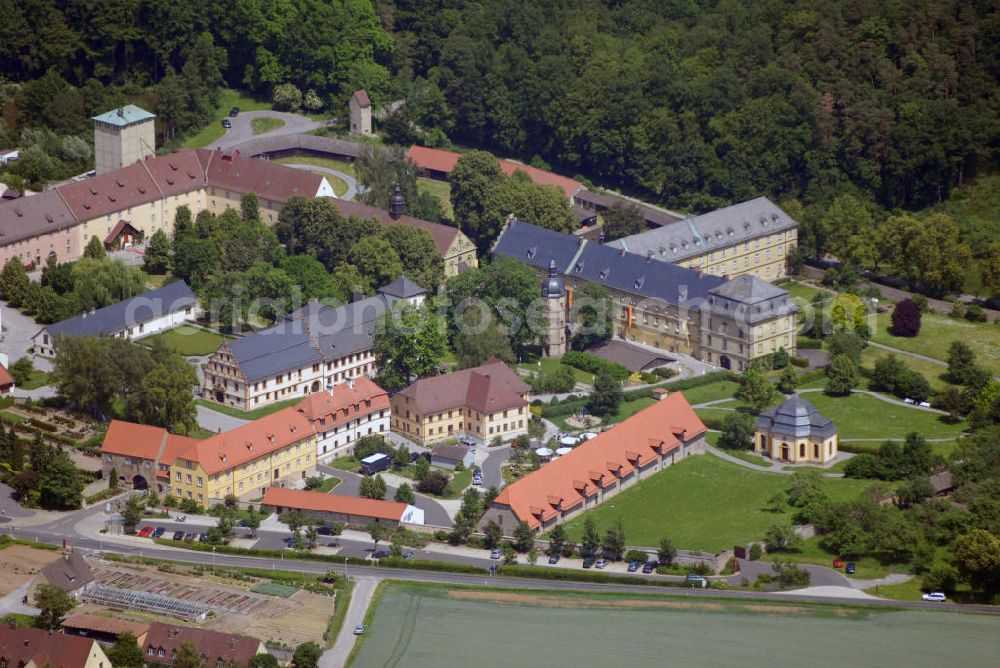 Aerial image Münnerstadt - Blick auf das Klostergelände Bildhausen in Münnerstadt. Das Kloster wurde 1158 durch Hermann von Stahleck, Pfalzgraf bei Rhein gegründet und von Mönchen aus dem Kloster Ebrach besiedelt. 1897 zogen Schwestern der St. Josefskongregation aus Ursberg ein und errichteten 1929 eine Behinderteneinrichtung. Diese wird seit 1996 von der kirchlichen Stiftung Dominikus-Ringeisen-Werk weitergeführt. Kontakt: Maria Bildhausen, 97702 Münnerstadt, Tel.: (09766) 94 00 5 - 0, Fax: (09766) 94 00 5 - 11, email: info@bildhausen.de