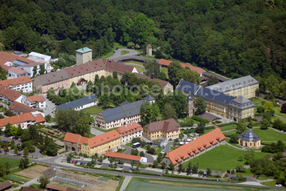 Aerial photograph Münnerstadt - Blick auf das Klostergelände Bildhausen in Münnerstadt. Das Kloster wurde 1158 durch Hermann von Stahleck, Pfalzgraf bei Rhein gegründet und von Mönchen aus dem Kloster Ebrach besiedelt. 1897 zogen Schwestern der St. Josefskongregation aus Ursberg ein und errichteten 1929 eine Behinderteneinrichtung. Diese wird seit 1996 von der kirchlichen Stiftung Dominikus-Ringeisen-Werk weitergeführt. Kontakt: Maria Bildhausen, 97702 Münnerstadt, Tel.: (09766) 94 00 5 - 0, Fax: (09766) 94 00 5 - 11, email: info@bildhausen.de