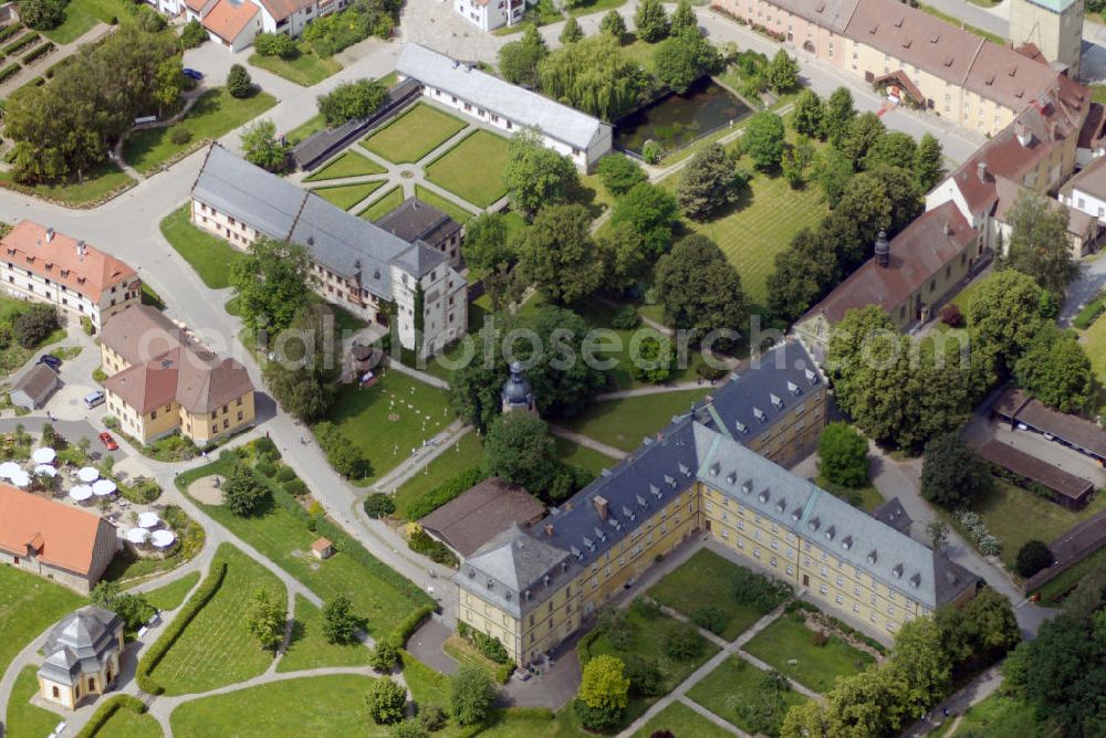 Aerial image Münnerstadt - Blick auf das Klostergelände Bildhausen in Münnerstadt. Das Kloster wurde 1158 durch Hermann von Stahleck, Pfalzgraf bei Rhein gegründet und von Mönchen aus dem Kloster Ebrach besiedelt. 1897 zogen Schwestern der St. Josefskongregation aus Ursberg ein und errichteten 1929 eine Behinderteneinrichtung. Diese wird seit 1996 von der kirchlichen Stiftung Dominikus-Ringeisen-Werk weitergeführt. Kontakt: Maria Bildhausen, 97702 Münnerstadt, Tel.: (09766) 94 00 5 - 0, Fax: (09766) 94 00 5 - 11, email: info@bildhausen.de