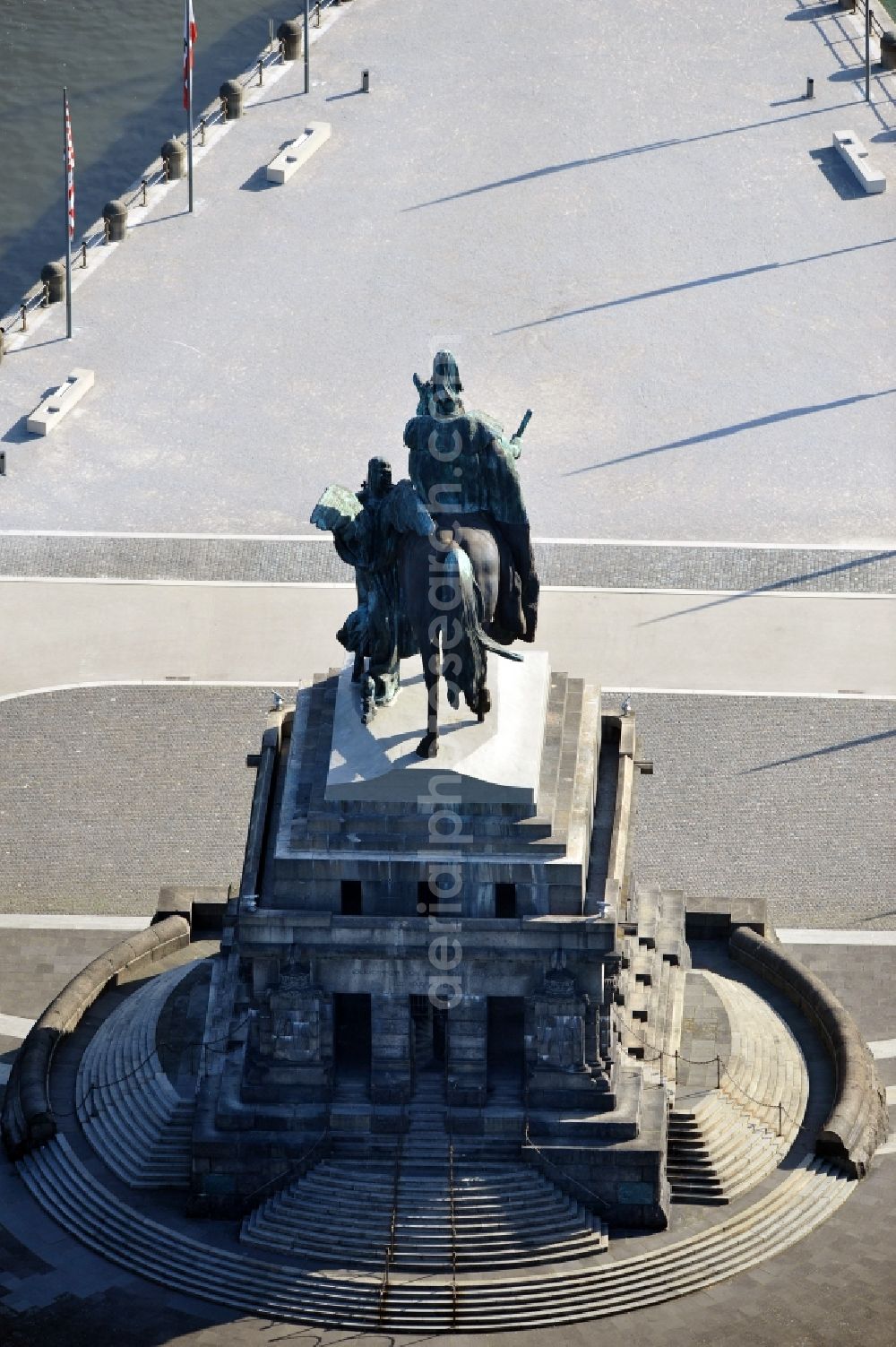 Koblenz from above - View of the artificially constructed peninsula Deutsches Eck in Koblenz. It is located at the confluence of the Moselle and Rhine. In 1897, there was a monumental equestrian statue of the German Kaiser Wilhelm I erected, which was conceived as a monument to the founding of the German empire in 1871. The German Corner is the landmark of the city Koblenz and a major attraction for tourists