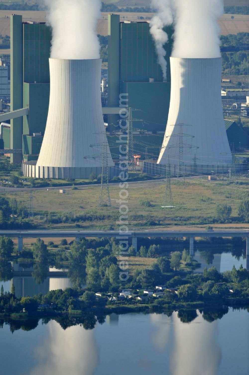 Aerial photograph Schkopau - View of power plant smokestacks in the mirror image of Rattmansdorfer pond in Schkopau in the state of Saxony-Anhalt. The two chimneys are part of the lignite-fired power plant of E.ON AG