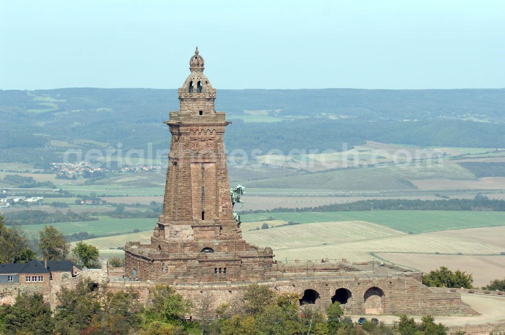 Aerial photograph Bad Frankenhausen - Blick auf das Kyffhäuser Denkmal, Das 81 Meter hohe Kyffhäuser-Denkmal ragt in der Abenddämmerung aus dem Kyffhäuser-Gebirge bei Bad Frankenhausen im Norden Thüringens heraus. Es wurde zwischen 1891 und 1896 als Kaiser-Wilhelm-Nationaldenkmal errichtet. Das Kyffhäuser-Denkmal ist mit jährlich zirka 200.000 Besuchern neben der Wartburg-Stiftung Eisenach der meistbesuchte Ort in Thüringen.