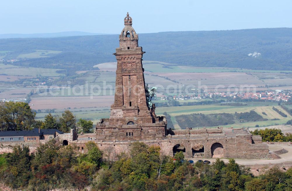 Bad Frankenhausen from the bird's eye view: Blick auf das Kyffhäuser Denkmal, Das 81 Meter hohe Kyffhäuser-Denkmal ragt in der Abenddämmerung aus dem Kyffhäuser-Gebirge bei Bad Frankenhausen im Norden Thüringens heraus. Es wurde zwischen 1891 und 1896 als Kaiser-Wilhelm-Nationaldenkmal errichtet. Das Kyffhäuser-Denkmal ist mit jährlich zirka 200.000 Besuchern neben der Wartburg-Stiftung Eisenach der meistbesuchte Ort in Thüringen.