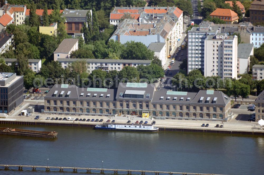 Aerial photograph Berlin - Blick auf eine Lagerhalle am Berliner Osthafen. Es ist das westliche der beiden symmetrisch angelegten Lagerhäuser. Dort hat der Musiksender MTV seit April 2004 seine Deutschlandzentrale in Betrieb. Links daneben entsteht ein weiterer Neubau des Unternehmens. Adresse: MTV Networks Germany GmbH, Stralauer Allee 6-7, 10245 Berlin, Tel. +49 (0)30 700 100 0, Fax +49 (0)30 700 100 599