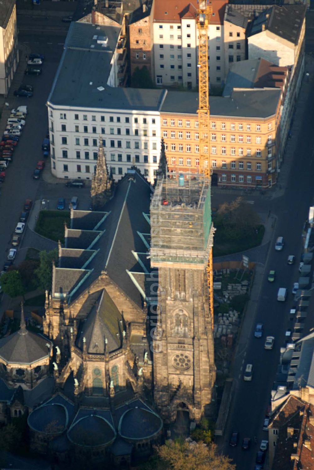 Leipzig from the bird's eye view: Blick auf die Leipziger Peterskirche. 1885 wurde der neogotische Bau geweiht. Er wurde im 2. Weltkrieg stark beschädigt. Bis heute wurde er noch nicht vollständig rekonstruiert. Zur Zeit wird der Kirchturm restauriert. Kontakt: Ev.-luth. Kirchgemeinde St. Petri, Schletterstraße 5, 04107 Leipzig, Tel.: 0341 - 213 16 12, Fax: 0341 - 149 44 32, E-Mail: info@peterskirche-leipzig.de,