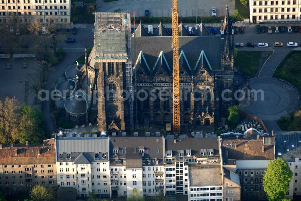 Leipzig from the bird's eye view: Blick auf die Leipziger Peterskirche. 1885 wurde der neogotische Bau geweiht. Er wurde im 2. Weltkrieg stark beschädigt. Bis heute wurde er noch nicht vollständig rekonstruiert. Zur Zeit wird der Kirchturm restauriert. Kontakt: Ev.-luth. Kirchgemeinde St. Petri, Schletterstraße 5, 04107 Leipzig, Tel.: 0341 - 213 16 12, Fax: 0341 - 149 44 32, E-Mail: info@peterskirche-leipzig.de,