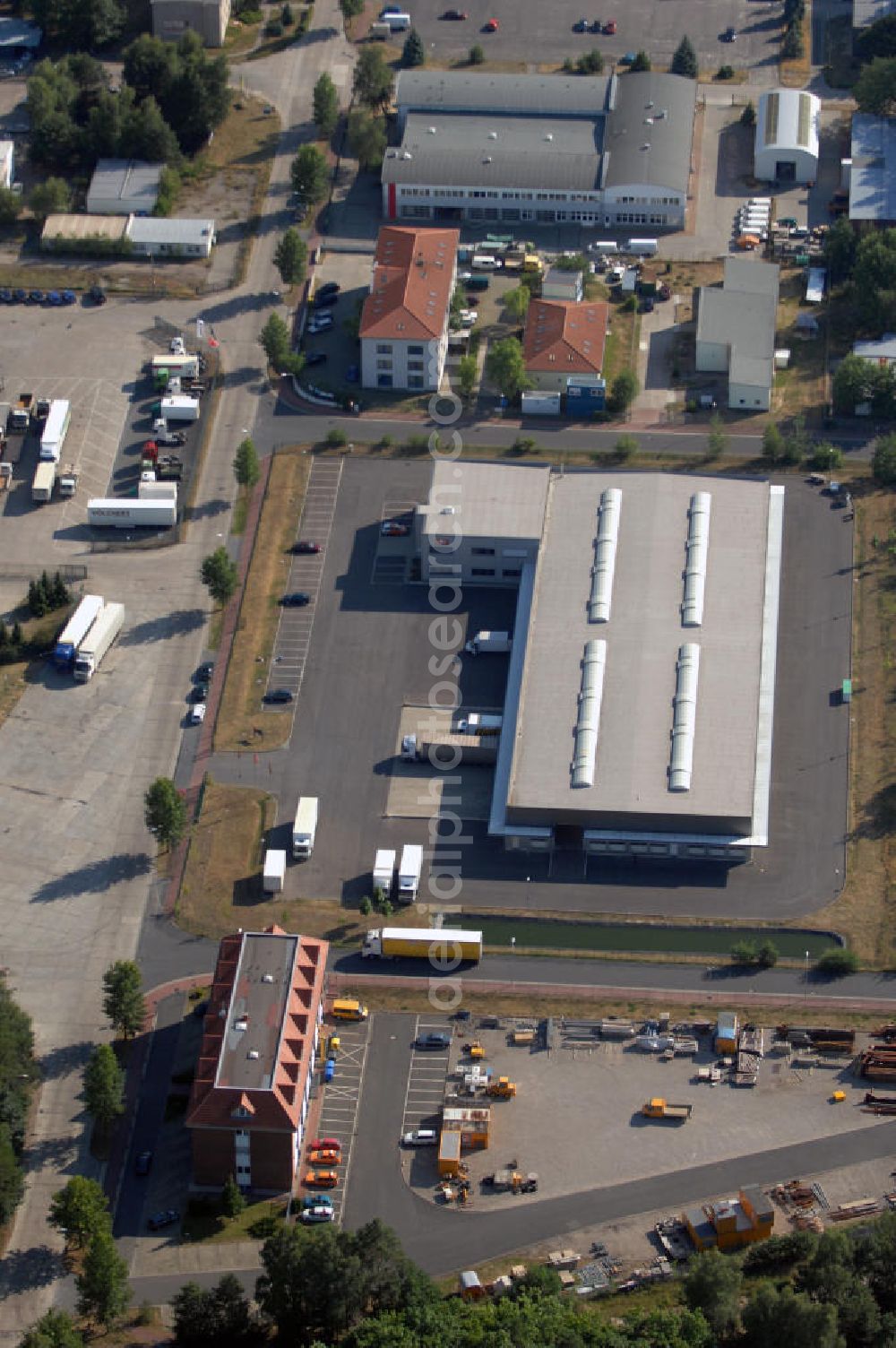 Aerial photograph Seddiner See - Blick auf ein Logistikzentrum in Seddiner See OT Neuseddin. Das Unternehmen Werner Egerland Automobillogistik GmbH & Co. KG ist im Gewerbegebiet Neuseddin angesiedelt. Dort erfüllt es Dienstleistungen rund um Pkw und Nutzfahrzeuge; z. B. Lackierungen, Lagerung, Transporte, Auf- und Umbauten. Adresse: 14554 Seddiner See, Am Fuchsbau 21, Tel. +49 (0)3 32 05 5 22 0, Fax +49 (0)3 32 05 5 22 14, Email j.ilgner@egerland.de