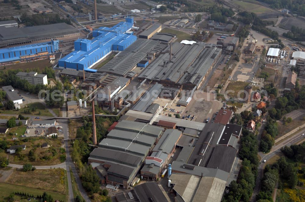 Hettstedt from above - Blick auf die Mansfelder Kupfer und Messing GmbH (MKM) in Hettstedt. Das Unternehmen ist ein führender europäischer Hersteller von Vorprodukten und Halbzeugen aus Kupfer und Kupferlegierungen. Mit über 1000 Mitarbeitern und einem Umsatz von 1.366 Mio Euro 2006 ist es das größte Unternehmen der Stadt. Kontakt: Lichtlöcherberg 40, 06333 Hettstedt, Email info@mkm-hett.de, Tel. +49 (0)3476 89 0, Fax +49 (0)3476 81 2476