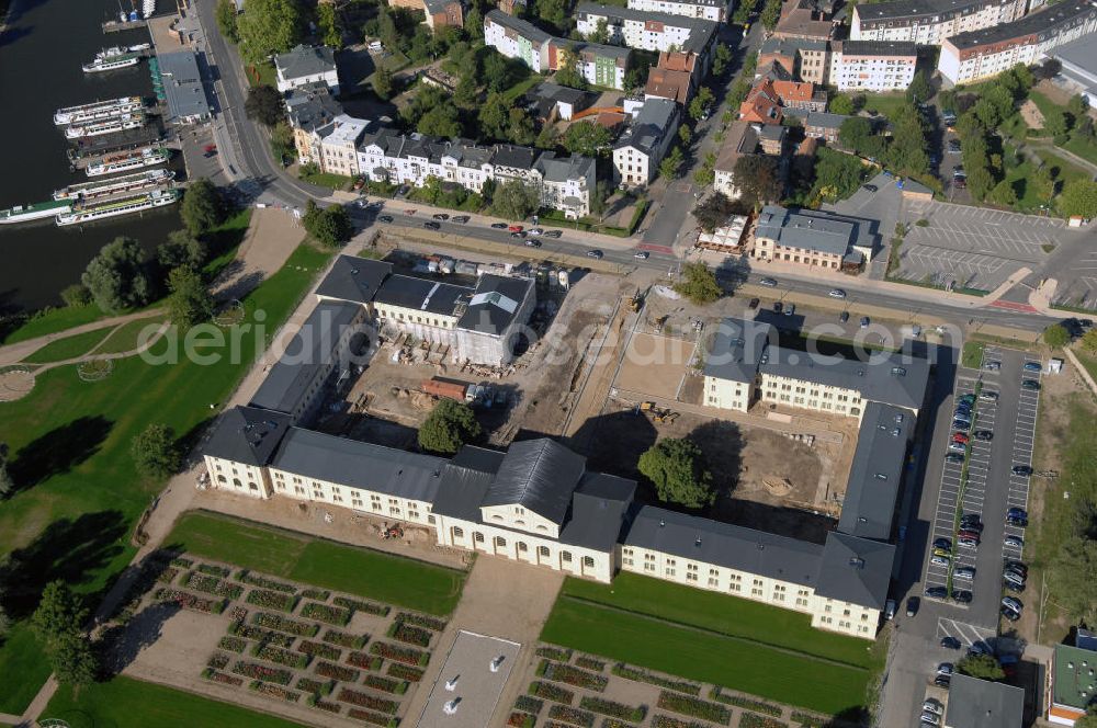 Aerial image Schwerin - Blick auf den Marstall in Schwerin. Der historische Marstall in Schwerin befindet sich auf einer Landzunge an der Werderstraße. Er wurde 1837 - 1842 nach Plänen von G. A. Demmler erbaut und diente als Pferdestall und Reithalle für die herzoglichen Pferde. Seit 1997 werden Teile des Gebäudes vom Technischen Museum genutzt. In den Seitenflügeln sind das Sozialministerium und das Ministerium für Bildung, Wissenschaft und Kultur untergebracht.