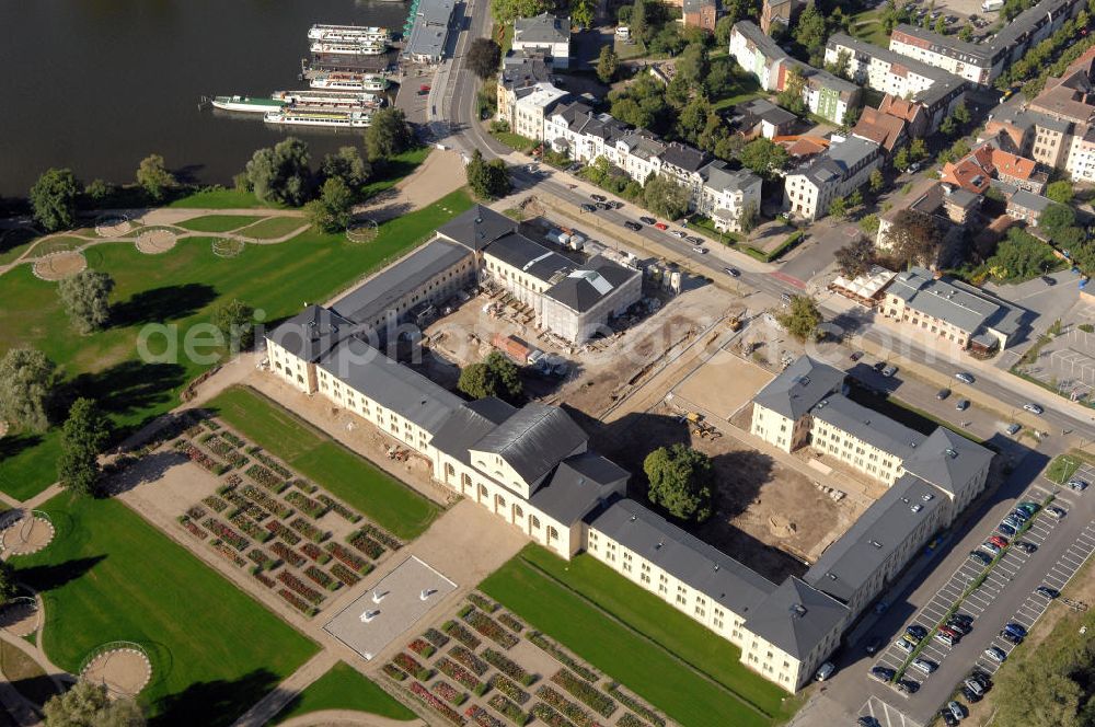 Aerial photograph Schwerin - Blick auf den Marstall in Schwerin. Der historische Marstall in Schwerin befindet sich auf einer Landzunge an der Werderstraße. Er wurde 1837 - 1842 nach Plänen von G. A. Demmler erbaut und diente als Pferdestall und Reithalle für die herzoglichen Pferde. Seit 1997 werden Teile des Gebäudes vom Technischen Museum genutzt. In den Seitenflügeln sind das Sozialministerium und das Ministerium für Bildung, Wissenschaft und Kultur untergebracht.