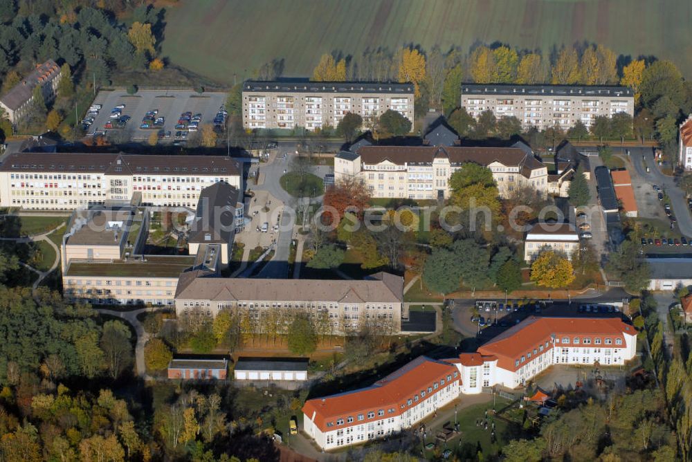 Aerial photograph Burg - Blick auf das MEDIGREIF Kreiskrankenhaus was gleichzeitig akademisches Lehrkrankenhaus der Otto-von-Guericke Universität Magdeburg ist und den Schulkomplex neben dem Krankenhaus in Burg. Das Schulgebäude teilen sich die Sonderschule für lernbehinderte Kinder Theodor Neubauer und die Lindenschule für geistig Behinderte in Burg. Kontakt: Sonderschule Lindenschule, In der Alten Kaserne 15a 39288 Burg, Tel. +49(0)3921 996757; Förderschule für Lernbehinderte Dr. Theodor Neubauer, In der Alten Kaserne 15a 39288 Burg, Tel. +49(0)3921 9848 27, Fax +49(0)3921 9848 30, Email: theodorneubauer@web.de, kontakt@sos-neubauer.bildung-lsa.de, leutung@sos-neubauer.bildung-lsa.de; MEDIGREIF Kreiskrankenhaus Burg GmbH, August-Bebel-Straße 55a 39288 Burg, Tel. +49(0)3921 96 0, Fax +49(0)3921 96 1026, Email: kkhburg.info@medigreif.de