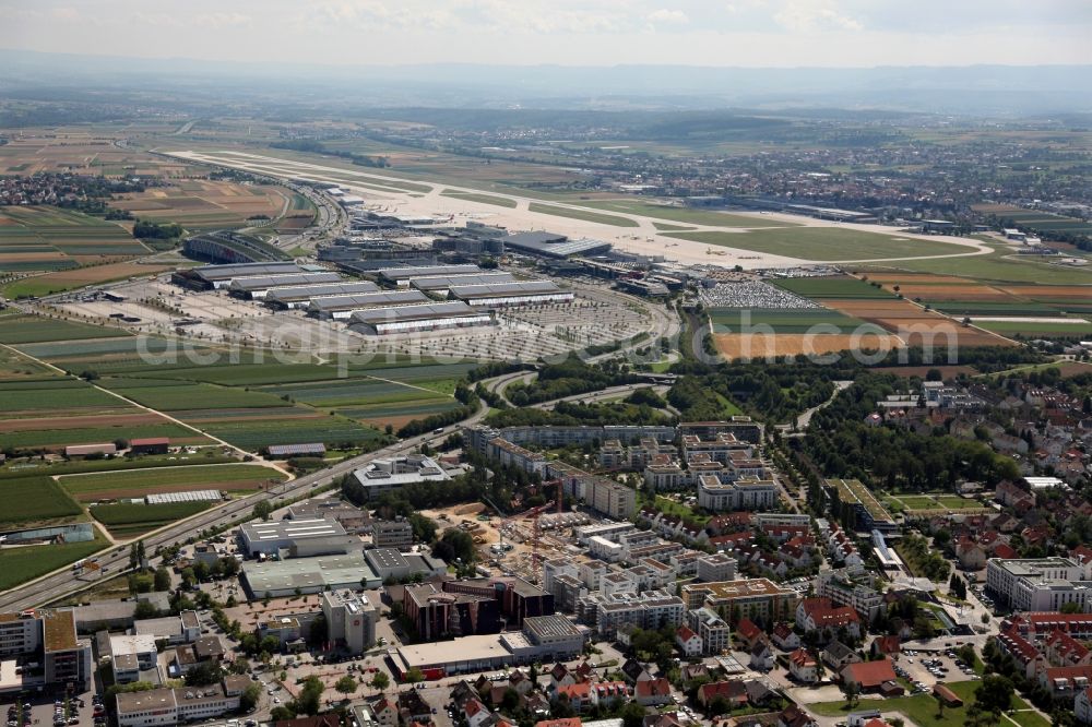 Stuttgart from the bird's eye view: View of the exhibition halls at Stuttgart Airport ( STR ) ans a residential area in the state of Baden-Wuerttemberg