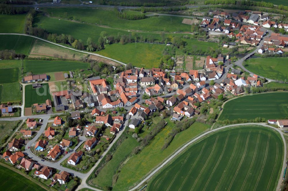 Aerial photograph Münnerstadt - Blick auf Münnerstadt OT Althausen. Umgeben wird die Stadt im Westen von Schindberg und Michelsberg, im Süden vom Karlsberg und im Osten von der Zent. Im Norden öffnet sich das weite Lauertal. Das Gebiet der heutigen Stadt Münnerstadt ist uraltes Siedlungsgebiet. Stadtverwaltung: Marktplatz 1, 97702 Münnerstadt , Tel. +49 (0)9733 8105 0