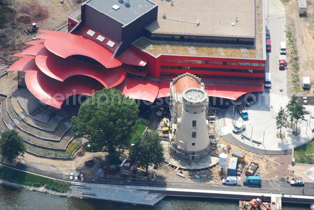 Potsdam from the bird's eye view: 11.07.2006 Blick auf den Neubau des Hans Otto Theaters in Potsdam, entworfen wurde es vom Kölner Architekten Gottfried Böhm. Bauherr ist der KIS Potsdam. Es befindet sich auf dem Kultur- und Gewerbestandort Schiffsbauergasse am Ufer des Tiefen Sees. In den Neubau integriert sind ein alter Gasometer sowie der Turm einer früheren Zichorienmühle. (Besucherservice und Kartenverkauf: ticket-service@hot.potsdam.de, Tel. 0331- 98 11 8 / URL: