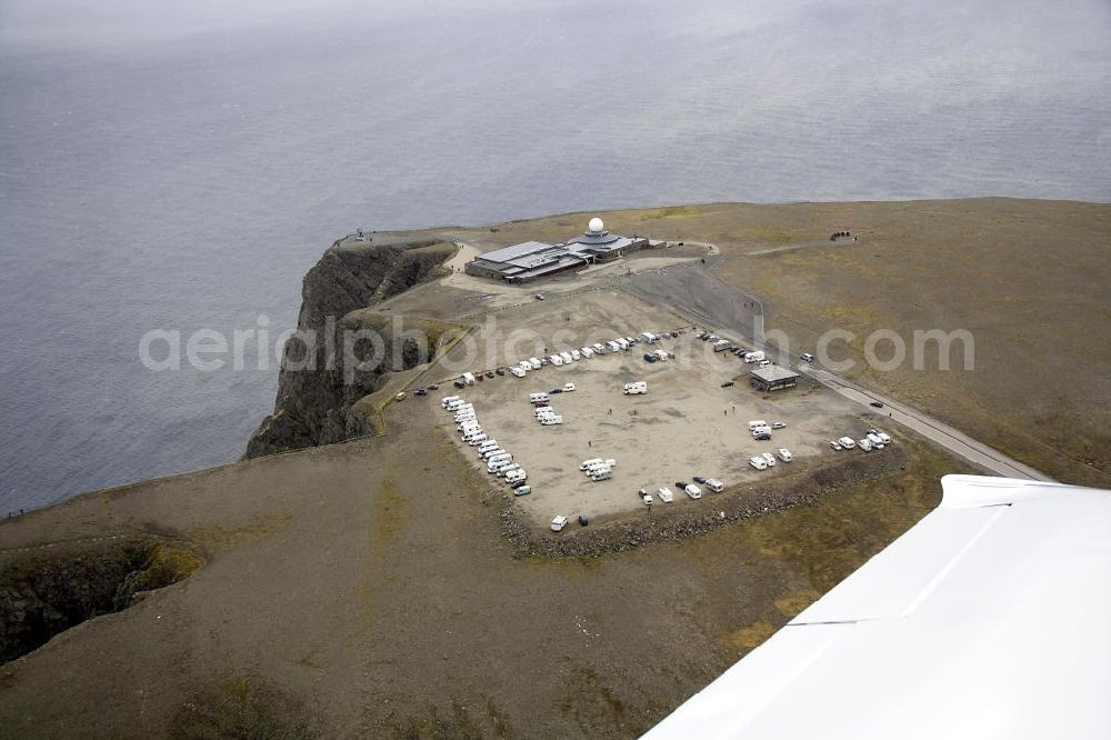 Aerial image Nordkapp - Das Nordkapp (deutsch Nordkap) ein steil aus dem Eismeer emporragendes Schieferplateau. Obwohl das Nordkapp ist nicht der nördlichste Punkt Europas ist, dieser liegt 3 km westlich, ist es doch ein beliebtes Touristenziel.The Nordkapp is a towering steep slate from the Arctic Ocean Plateau. Although the North Cape is not the northernmost point of Europe, this is located 3 km to the west, it is nevertheless a popular tourist destination.