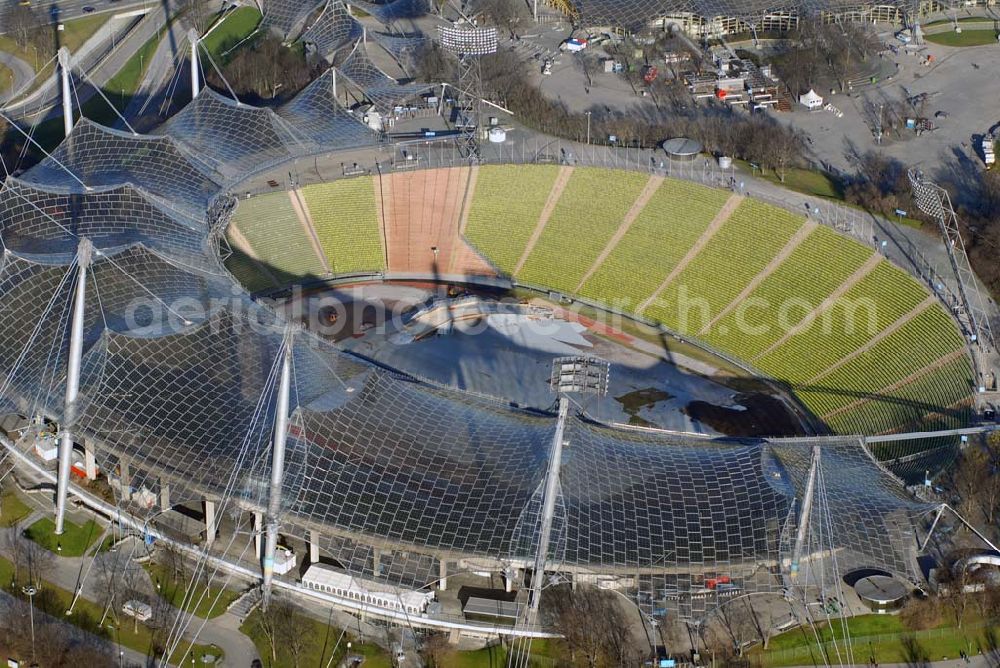 München from the bird's eye view: , Blick auf das Olympiastadion München. Das Olympiastadion München war die zentrale Sportstätte im Olympiapark und Hauptort der Olympischen Sommerspiele 1972. Das Olympiastadion gilt als die bundesdeutsche Sportstätte, in dem die meisten internationalen Sportturniere ausgetragen wurden. Olympiapark München GmbH, Spiridon-Louis-Ring 21, 80809 München, Tel.: 089/30 67-0, Fax: 089/30 67-22 22, E-Mail: infoolympiapark-muenchen.de