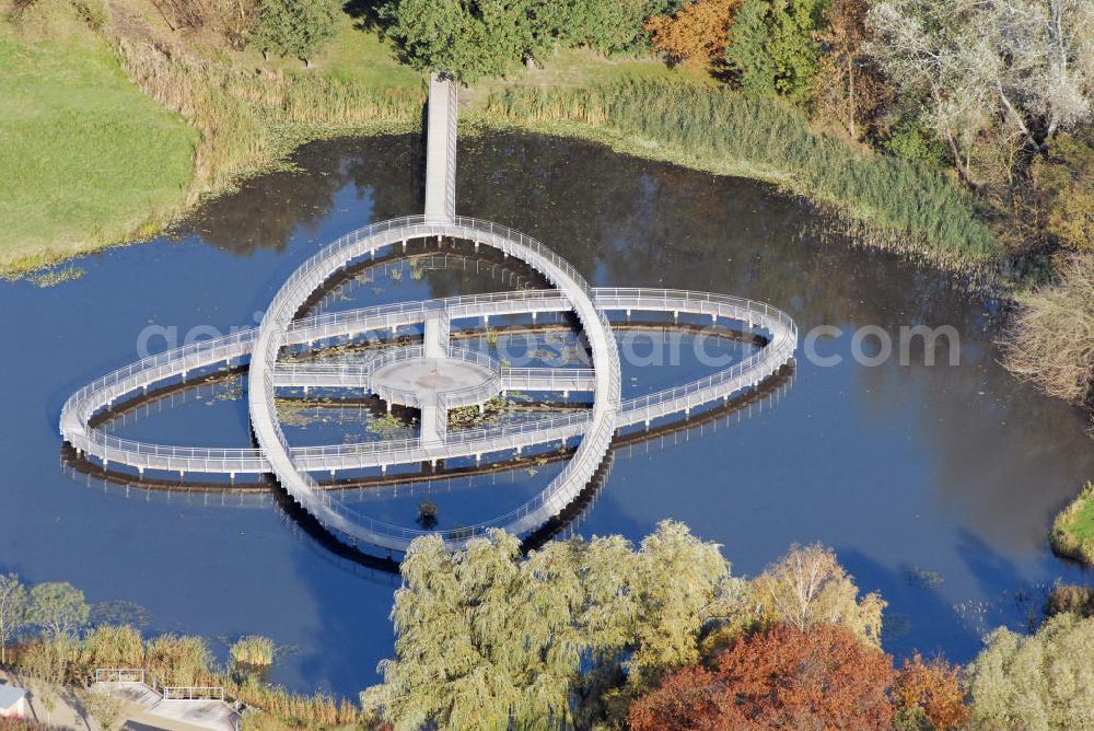 Aerial photograph Rathenow - Blick auf das ehem. Gartenschaugelände der 3. Brandenburgischen Landesgartenschau (LAGA) in Rathenow. Seit April 2007 wird das LAGA-Gelände auf der Schwedendamminsel als Optikpark Rathenow genutzt. Angebote: Farbenquell, Stadtplatz, Optikskulpturen, Installationen, Farbräume, Spielbereiche, Steganlagen, Floßfahrten, Café, Weltzeituhr, Strahlenbeete, Ruhebereiche uvm. Kontakt: c/o Landesgartenschau Rathenow 2006 gGmbH, Schwedendamm 1, 14712 Rathenow, Tel.: 03385/49 85 0, E-mail: info@optikpark-rathenow.de,