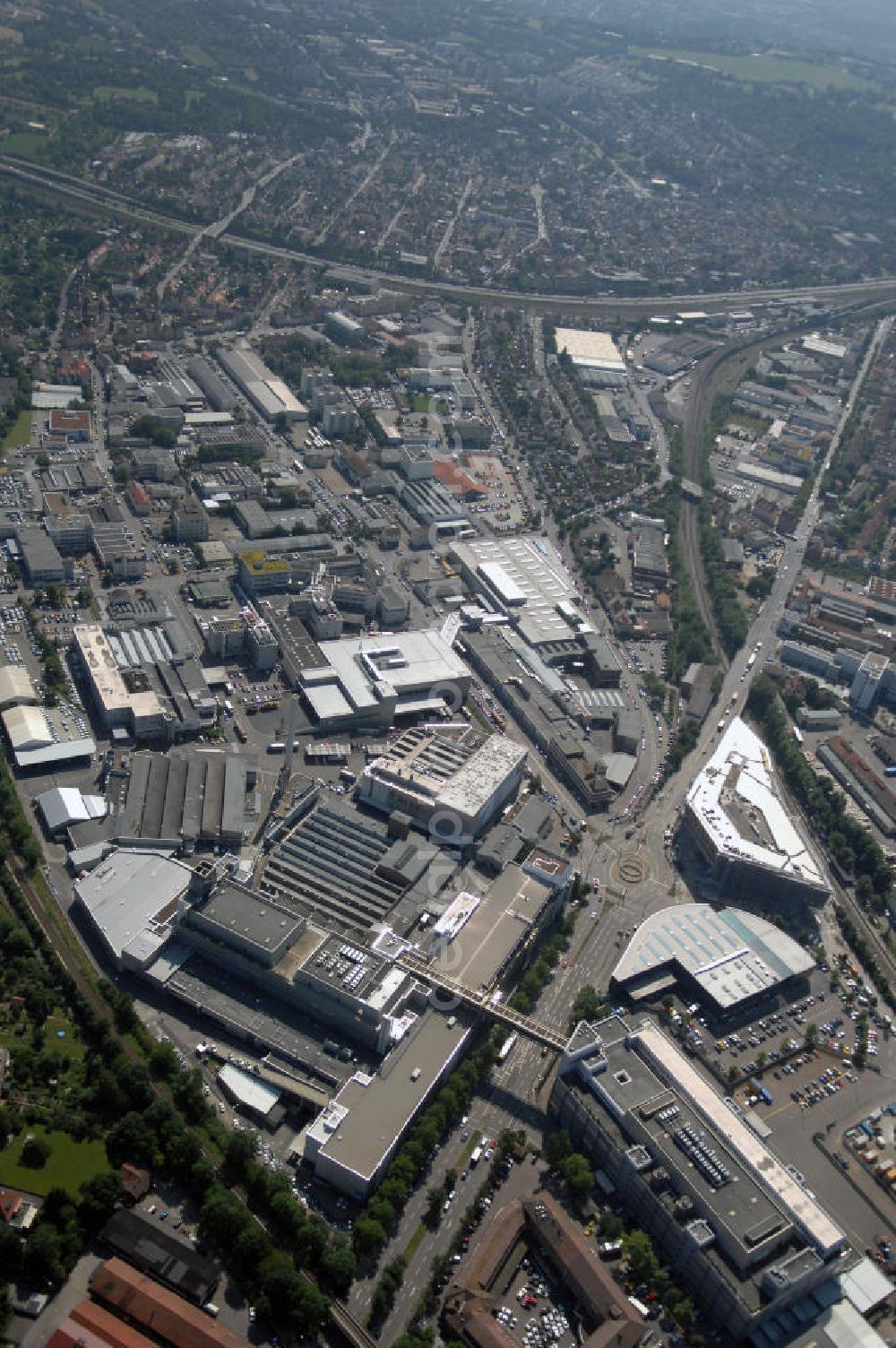 Stuttgart from above - Blick auf das Porsche-Werk in Stuttgart-Zuffenhausen. Die Dr. Ing. h. c. F. Porsche AG ist ein deutscher Sportwagenhersteller. Porsche wurde 1931 als Konstruktionsbüro gegründet. Seit 2007 ist die Porsche AG ein Tochterunternehmen der Porsche Automobil Holding SE. Kontakt: Porsche Niederlassung Stuttgart GmbH, Porscheplatz 9, 70435 Stuttgart, Tel. +49 (0)711 911 26220, Fax +49 (0)711 911 26262, info.pzstuttgart@porsche.de