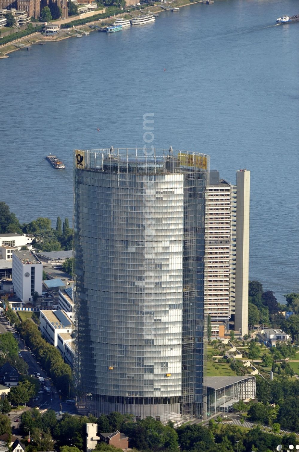 Bonn from the bird's eye view: View of the Post Tower in Bonn in North Rhine-Westphalia. The 162.5-meter-high office tower is the headquarters of the German logistics company Deutsche Post DHL and is owned by Deutsche Post AG. It was designed by the architects Murphy and Jahn and built from 2000 to 2002 in post-modern style