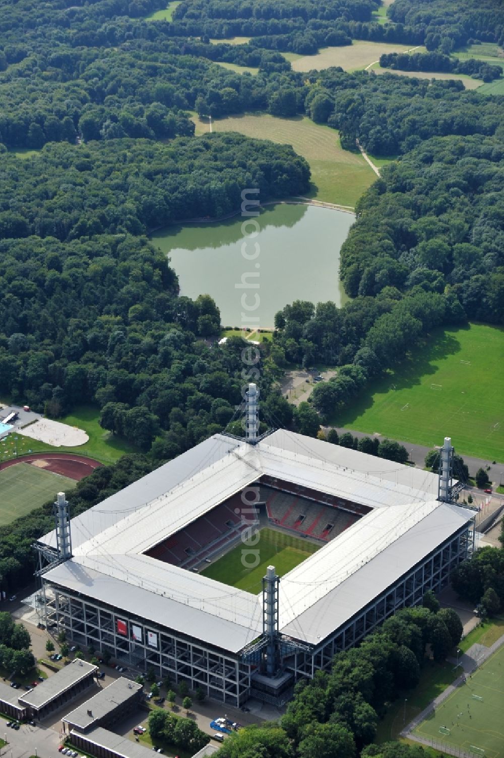 Köln from the bird's eye view: The RheinEnergieStadion is a football stadium in the district Mungersdorf of Cologne. It is the home ground of the football club 1. FC Koeln. Its predecessor was the Mungerdorferstadion, which was built at the same place. Through a sponsorship deal, the stadium now has the name of the energy provider Rhein Energie Koeln