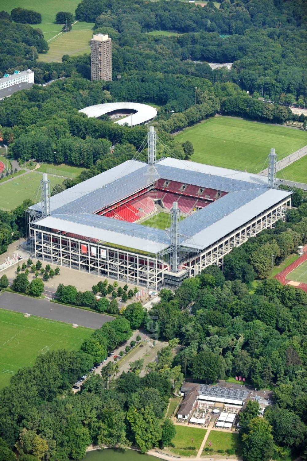 Köln from the bird's eye view: The RheinEnergieStadion is a football stadium in the district Mungersdorf of Cologne. It is the home ground of the football club 1. FC Koeln. Its predecessor was the Mungerdorferstadion, which was built at the same place. Through a sponsorship deal, the stadium now has the name of the energy provider Rhein Energie Koeln